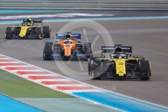 World © Octane Photographic Ltd. Formula 1 – Abu Dhabi GP - Race. Renault Sport F1 Team RS19 – Daniel Ricciardo and Nico Hulkenberg sandwiching the  McLaren MCL34 of Carlos Sainz. Yas Marina Circuit, Abu Dhabi, UAE. Sunday 1st December 2019.
