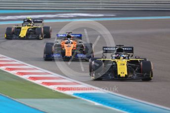 World © Octane Photographic Ltd. Formula 1 – Abu Dhabi GP - Race. Renault Sport F1 Team RS19 – Daniel Ricciardo and Nico Hulkenberg sandwiching the McLaren MCL34 of Carlos Sainz. Yas Marina Circuit, Abu Dhabi, UAE. Sunday 1st December 2019.