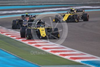 World © Octane Photographic Ltd. Formula 1 – Abu Dhabi GP - Race. Renault Sport F1 Team RS19 – Daniel Ricciardo and Nico Hulkenberg either side of the Haas F1 Team VF19 of Kevin Magnussen. Yas Marina Circuit, Abu Dhabi, UAE. Sunday 1st December 2019.