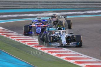 World © Octane Photographic Ltd. Formula 1 – Abu Dhabi GP - Race. Mercedes AMG Petronas Motorsport AMG F1 W10 EQ Power+ - Valtteri Bottas, Scuderia Toro Rosso STR14 – Daniil Kvyat and Haas F1 Team VF19 – Romain Grosjean. . Yas Marina Circuit, Abu Dhabi, UAE. Sunday 1st December 2019.