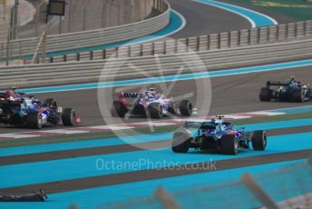 World © Octane Photographic Ltd. Formula 1 – Abu Dhabi GP - Race. Scuderia Toro Rosso STR14 – Pierre Gasly (with missing front wing) runs wide through turn1. Yas Marina Circuit, Abu Dhabi, UAE. Sunday 1st December 2019.