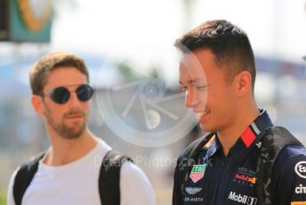 World © Octane Photographic Ltd. Formula 1 – Abu Dhabi GP - Paddock. Aston Martin Red Bull Racing RB15 – Alexander Albon and Haas F1 Team VF19 – Romain Grosjean. Yas Marina Circuit, Abu Dhabi, UAE. Thursday 28th November 2019.