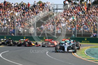 World © Octane Photographic Ltd. Formula 1 – Australian GP Race. Mercedes AMG Petronas Motorsport AMG F1 W10 EQ Power+ - Valtteri Bottas and Lewis Hamilton lead in turn 1 on lap 1. Melbourne, Australia. Sunday 17th March 2019.