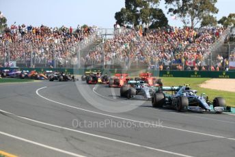 World © Octane Photographic Ltd. Formula 1 – Australian GP Race. Mercedes AMG Petronas Motorsport AMG F1 W10 EQ Power+ - Valtteri Bottas and Lewis Hamilton lead in turn 1 on lap 1. Melbourne, Australia. Sunday 17th March 2019.