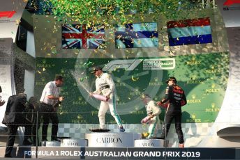 World © Octane Photographic Ltd. Formula 1 – Australian GP Podium. Mercedes AMG Petronas Motorsport AMG F1 W10 EQ Power+ - Valtteri Bottas and Lewis Hamilton and Aston Martin Red Bull Racing RB15 – Max Verstappen. Melbourne, Australia. Sunday 17th March 2019.