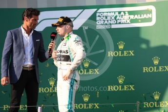 World © Octane Photographic Ltd. Formula 1 – Australian GP Podium. Mercedes AMG Petronas Motorsport AMG F1 W10 EQ Power+ - Valtteri Bottas interviewed by Mark Webber. Melbourne, Australia. Sunday 17th March 2019.