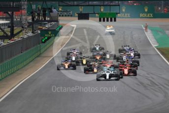 World © Octane Photographic Ltd. Formula 1 – British GP - Race. Mercedes AMG Petronas Motorsport AMG F1 W10 EQ Power+ - Valtteri Bottas leads the race start. Silverstone Circuit, Towcester, Northamptonshire. Sunday 14th July 2019.