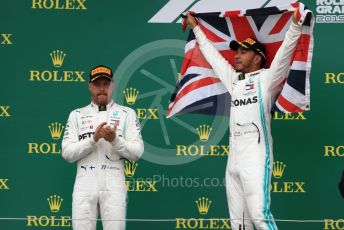 World © Octane Photographic Ltd. Formula 1 – British GP - Race - Podium. Mercedes AMG Petronas Motorsport AMG F1 W10 EQ Power+ - Lewis Hamilton and Valtteri Bottas. Silverstone Circuit, Towcester, Northamptonshire. Sunday 14th July 2019.
