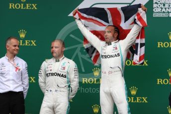 World © Octane Photographic Ltd. Formula 1 – British GP - Race - Podium. Mercedes AMG Petronas Motorsport AMG F1 W10 EQ Power+ - Lewis Hamilton and Valtteri Bottas. Silverstone Circuit, Towcester, Northamptonshire. Sunday 14th July 2019.