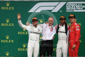 World © Octane Photographic Ltd. Formula 1 – British GP - Race - Podium. Mercedes AMG Petronas Motorsport AMG F1 W10 EQ Power+ - Lewis Hamilton, Valtteri Bottas and Scuderia Ferrari SF90 – Charles Leclerc. Silverstone Circuit, Towcester, Northamptonshire. Sunday 14th July 2019.