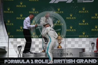 World © Octane Photographic Ltd. Formula 1 – British GP - Race - Podium. Mercedes AMG Petronas Motorsport AMG F1 W10 EQ Power+ - Lewis Hamilton and Valtteri Bottas. Silverstone Circuit, Towcester, Northamptonshire. Sunday 14th July 2019.