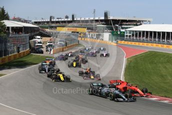 World © Octane Photographic Ltd. Formula 1 – Canadian GP. Race. Mercedes AMG Petronas Motorsport AMG F1 W10 EQ Power+ - Lewis Hamilton and Scuderia Ferrari SF90 – Charles Leclerc and teh pack in turn 2. Circuit de Gilles Villeneuve, Montreal, Canada. Sunday 9th June 2019.