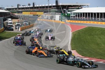 World © Octane Photographic Ltd. Formula 1 – Canadian GP. Race. Mercedes AMG Petronas Motorsport AMG F1 W10 EQ Power+ - Valtteri Bottas and the pack in turn 2. Circuit de Gilles Villeneuve, Montreal, Canada. Sunday 9th June 2019.