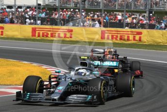 World © Octane Photographic Ltd. Formula 1 – Canadian GP. Race. Mercedes AMG Petronas Motorsport AMG F1 W10 EQ Power+ - Valtteri Bottas and Aston Martin Red Bull Racing RB15 – Max Verstappen. . Circuit de Gilles Villeneuve, Montreal, Canada. Sunday 9th June 2019.