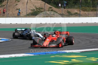 World © Octane Photographic Ltd. Formula 1 – German GP - Practice 1. Scuderia Ferrari SF90 – Sebastian Vettel and Mercedes AMG Petronas Motorsport AMG F1 W10 EQ Power+ - Valtteri Bottas. Hockenheimring, Hockenheim, Germany. Friday 26th July 2019.