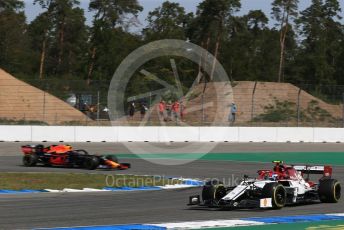 World © Octane Photographic Ltd. Formula 1 – German GP - Practice 1. Alfa Romeo Racing C38 – Antonio Giovinazzi and Aston Martin Red Bull Racing RB15 – Pierre Gasly. Hockenheimring, Hockenheim, Germany. Friday 26th July 2019.