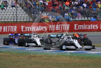 World © Octane Photographic Ltd. Formula 1 – German GP - Race. Mercedes AMG Petronas Motorsport AMG F1 W10 EQ Power+ - Valtteri Bottas and Lewis Hamilton with Scuderia Toro Rosso STR14 – Alexander Albon. Hockenheimring, Hockenheim, Germany. Sunday 28th July 2019.