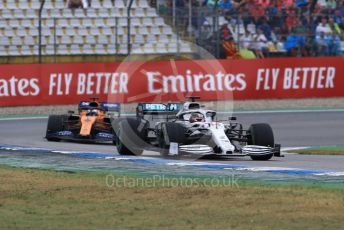 World © Octane Photographic Ltd. Formula 1 – German GP - Race. Mercedes AMG Petronas Motorsport AMG F1 W10 EQ Power+ - Lewis Hamilton and McLaren MCL34 – Carlos Sainz. Hockenheimring, Hockenheim, Germany. Sunday 28th July 2019.