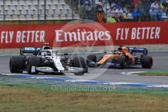 World © Octane Photographic Ltd. Formula 1 – German GP - Race. Mercedes AMG Petronas Motorsport AMG F1 W10 EQ Power+ - Valtteri Bottas and McLaren MCL34 – Carlos Sainz. Hockenheimring, Hockenheim, Germany. Sunday 28th July 2019.