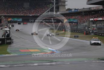 World © Octane Photographic Ltd. Formula 1 – German GP - Race. Safety car deployed ahead of he leading Lewis Hamilton, Aston Martin Red Bull Racing RB15 – Max Verstappen and Mercedes AMG Petronas Motorsport AMG F1 W10 EQ Power+ - Valtteri Bottas. Hockenheimring, Hockenheim, Germany. Sunday 28th July 2019.