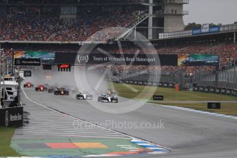 World © Octane Photographic Ltd. Formula 1 – German GP - Race. Mercedes AMG Petronas Motorsport AMG F1 W10 EQ Power+ - Lewis Hamilton and Valtteri Bottas lead the pack. Hockenheimring, Hockenheim, Germany. Sunday 28th July 2019.