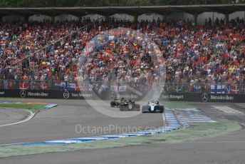 World © Octane Photographic Ltd. Formula 1 – German GP - Race. Rich Energy Haas F1 Team VF19 – Romain Grosjean and ROKiT Williams Racing FW 42 – George Russell with Renault Sport F1 Team RS19 – Daniel Ricciardo. Hockenheimring, Hockenheim, Germany. Sunday 28th July 2019.