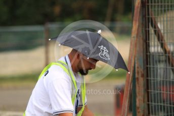 World © Octane Photographic Ltd. Formula 1 – Hungarian GP - Practice 1. Marshal in rain hat. Hungaroring, Budapest, Hungary. Friday 2nd August 2019.