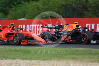 World © Octane Photographic Ltd. Formula 1 – Hungarian GP - Practice 1. Scuderia Ferrari SF90 – Charles Leclerc and Aston Martin Red Bull Racing RB15 – Pierre Gasly. Hungaroring, Budapest, Hungary. Friday 2nd August 2019.