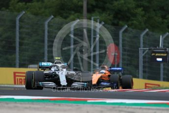 World © Octane Photographic Ltd. Formula 1 – Hungarian GP - Practice 2. Mercedes AMG Petronas Motorsport AMG F1 W10 EQ Power+ - Valtteri Bottas and McLaren MCL34 – Carlos Sainz. Hungaroring, Budapest, Hungary. Friday 2nd August 2019.