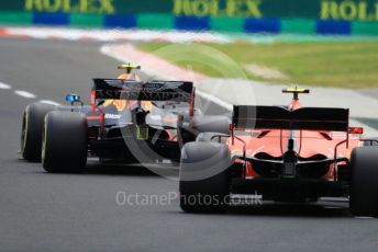 World © Octane Photographic Ltd. Formula 1 – Hungarian GP - Practice 3. Aston Martin Red Bull Racing RB15 – Pierre Gasly and Scuderia Ferrari SF90 – Charles Leclerc. Hungaroring, Budapest, Hungary. Saturday 3rd August 2019.