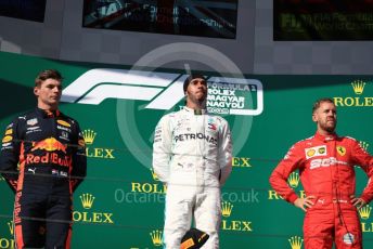 World © Octane Photographic Ltd. Formula 1 – Hungarian GP - Podium. Mercedes AMG Petronas Motorsport AMG F1 W10 EQ Power+ - Lewis Hamilton, Aston Martin Red Bull Racing RB15 – Max Verstappen and Scuderia Ferrari SF90 – Sebastian Vettel. Hungaroring, Budapest, Hungary. Sunday 4th August 2019.