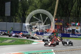 World © Octane Photographic Ltd. Formula 1 – Italian GP - Race. Scuderia Ferrari SF90 – Charles Leclerc and Mercedes AMG Petronas Motorsport AMG F1 W10 EQ Power+ - Valtteri Bottas leads into turn 1. Autodromo Nazionale Monza, Monza, Italy. Sunday 8th September 2019.