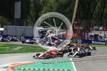 World © Octane Photographic Ltd. Formula 1 – Italian GP - Race. Scuderia Ferrari SF90 – Charles Leclerc and Mercedes AMG Petronas Motorsport AMG F1 W10 EQ Power+ - Valtteri Bottas leads into turn 1. Autodromo Nazionale Monza, Monza, Italy. Sunday 8th September 2019.