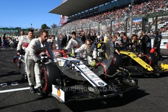 World © Octane Photographic Ltd. Formula 1 – Japanese GP - Grid. Alfa Romeo Racing C38 – Kimi Raikkonen and Renault Sport F1 Team RS19 – Nico Hulkenberg. Suzuka Circuit, Suzuka, Japan. Sunday 13th October 2019.