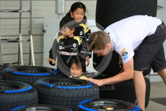 World © Octane Photographic Ltd. Formula 1 – Japanese GP - Paddock. Young Renault fans helps a McLaren tyre technicianPirelli full wet tyre. Suzuka Circuit, Suzuka, Japan. Thursday 10th October 2019.