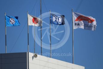 World © Octane Photographic Ltd. Formula 1 – Japanese GP - Qualifying. Strong wings blowing the FIA, Japanese and F1 flags. Suzuka Circuit, Suzuka, Japan. Sunday 13th October 2019.