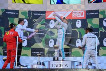 World © Octane Photographic Ltd. Formula 1 – Japanese GP - Podium. Mercedes AMG Petronas Motorsport AMG F1 W10 EQ Power+ - Valtteri Bottas and Lewis Hamilton with Chief Aerodynamicist, Scuderia Ferrari SF90 – Sebastian Vettel. Suzuka Circuit, Suzuka, Japan. Sunday 13th October 2019.