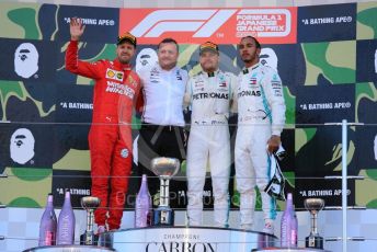 World © Octane Photographic Ltd. Formula 1 – Japanese GP - Podium. Mercedes AMG Petronas Motorsport AMG F1 W10 EQ Power+ - Valtteri Bottas and Lewis Hamilton with Chief Aerodynamicist, Scuderia Ferrari SF90 – Sebastian Vettel. Suzuka Circuit, Suzuka, Japan. Sunday 13th October 2019.