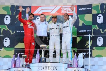 World © Octane Photographic Ltd. Formula 1 – Japanese GP - Podium. Mercedes AMG Petronas Motorsport AMG F1 W10 EQ Power+ - Valtteri Bottas and Lewis Hamilton with Chief Aerodynamicist, Scuderia Ferrari SF90 – Sebastian Vettel. Suzuka Circuit, Suzuka, Japan. Sunday 13th October 2019.