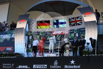 World © Octane Photographic Ltd. Formula 1 – Japanese GP - Podium. Mercedes AMG Petronas Motorsport AMG F1 W10 EQ Power+ - Valtteri Bottas and Lewis Hamilton with Chief Aerodynamicist, Scuderia Ferrari SF90 – Sebastian Vettel. Suzuka Circuit, Suzuka, Japan. Sunday 13th October 2019.