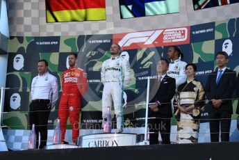 World © Octane Photographic Ltd. Formula 1 – Japanese GP - Podium. Mercedes AMG Petronas Motorsport AMG F1 W10 EQ Power+ - Valtteri Bottas and Lewis Hamilton with Chief Aerodynamicist, Scuderia Ferrari SF90 – Sebastian Vettel. Suzuka Circuit, Suzuka, Japan. Sunday 13th October 2019.