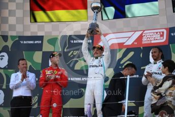 World © Octane Photographic Ltd. Formula 1 – Japanese GP - Podium. Mercedes AMG Petronas Motorsport AMG F1 W10 EQ Power+ - Valtteri Bottas and Lewis Hamilton with Chief Aerodynamicist, Scuderia Ferrari SF90 – Sebastian Vettel. Suzuka Circuit, Suzuka, Japan. Sunday 13th October 2019.