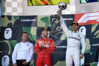 World © Octane Photographic Ltd. Formula 1 – Japanese GP - Podium. Mercedes AMG Petronas Motorsport AMG F1 W10 EQ Power+ - Valtteri Bottas with Chief Aerodynamicist, Scuderia Ferrari SF90 – Sebastian Vettel. Suzuka Circuit, Suzuka, Japan. Sunday 13th October 2019.