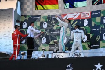 World © Octane Photographic Ltd. Formula 1 – Japanese GP - Podium. Mercedes AMG Petronas Motorsport AMG F1 W10 EQ Power+ - Valtteri Bottas and Lewis Hamilton with Chief Aerodynamicist, Scuderia Ferrari SF90 – Sebastian Vettel. Suzuka Circuit, Suzuka, Japan. Sunday 13th October 2019.