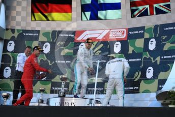 World © Octane Photographic Ltd. Formula 1 – Japanese GP - Podium. Mercedes AMG Petronas Motorsport AMG F1 W10 EQ Power+ - Valtteri Bottas and Lewis Hamilton with Chief Aerodynamicist, Scuderia Ferrari SF90 – Sebastian Vettel. Suzuka Circuit, Suzuka, Japan. Sunday 13th October 2019.