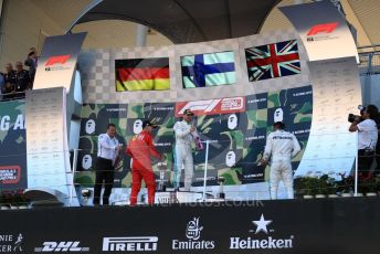 World © Octane Photographic Ltd. Formula 1 – Japanese GP - Podium. Mercedes AMG Petronas Motorsport AMG F1 W10 EQ Power+ - Valtteri Bottas and Lewis Hamilton with Chief Aerodynamicist, Scuderia Ferrari SF90 – Sebastian Vettel. Suzuka Circuit, Suzuka, Japan. Sunday 13th October 2019.