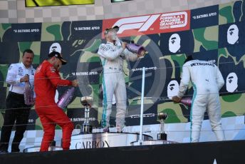 World © Octane Photographic Ltd. Formula 1 – Japanese GP - Podium. Mercedes AMG Petronas Motorsport AMG F1 W10 EQ Power+ - Valtteri Bottas and Lewis Hamilton with Chief Aerodynamicist, Scuderia Ferrari SF90 – Sebastian Vettel. Suzuka Circuit, Suzuka, Japan. Sunday 13th October 2019.