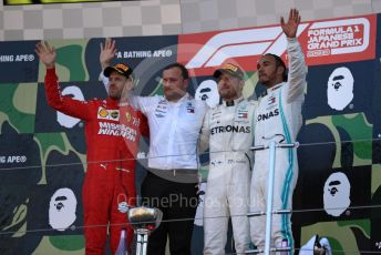 World © Octane Photographic Ltd. Formula 1 – Japanese GP - Podium. Mercedes AMG Petronas Motorsport AMG F1 W10 EQ Power+ - Valtteri Bottas and Lewis Hamilton with Chief Aerodynamicist, Scuderia Ferrari SF90 – Sebastian Vettel. Suzuka Circuit, Suzuka, Japan. Sunday 13th October 2019.