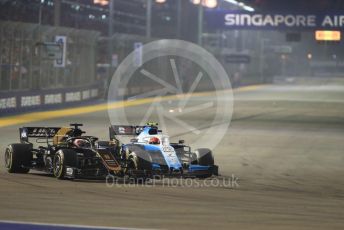 World © Octane Photographic Ltd. Formula 1 – Singapore GP - Race. Haas F1 Team VF19 – Romain Grosjean and ROKiT Williams Racing FW 42 – George Russell. Marina Bay Street Circuit, Singapore. Sunday 22nd September 2019.