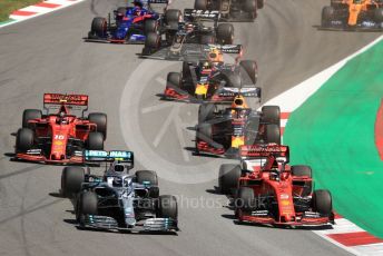 World © Octane Photographic Ltd. Formula 1 – Spanish GP. Race. Mercedes AMG Petronas Motorsport AMG F1 W10 EQ Power+ - Valtteri Bottas and Scuderia Ferrari SF90 – Sebastian Vettel. Circuit de Barcelona Catalunya, Spain. Sunday 12th May 2019.